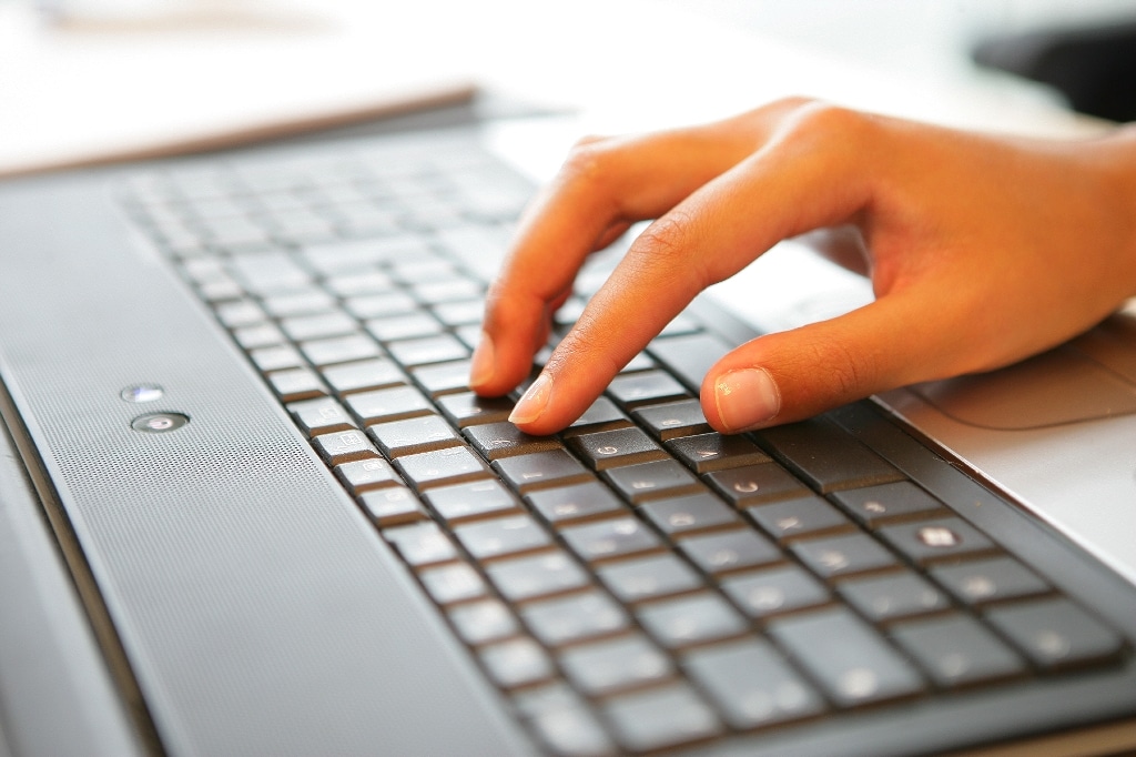 business woman hand laptop keyboard