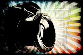 digital photography camera on color abstract background
