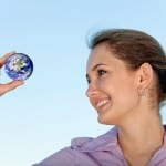 business woman holding small globe