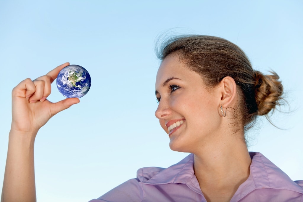 business woman holding small globe