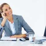 business woman on phone at desk