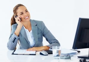 business woman on phone at desk