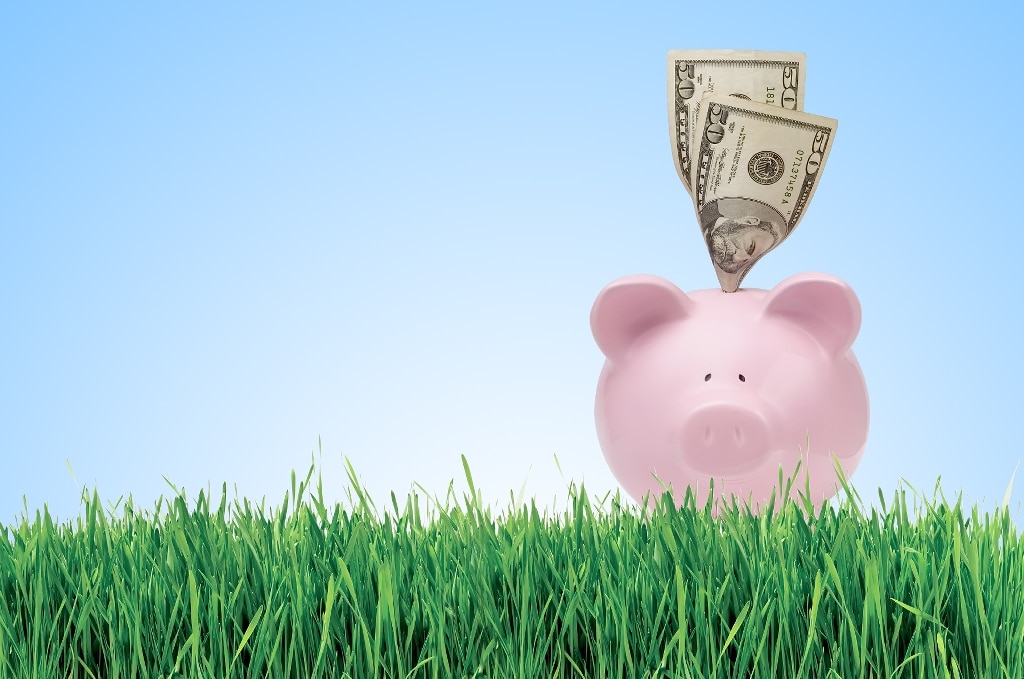 retirement savings money stuffed in piggy bank