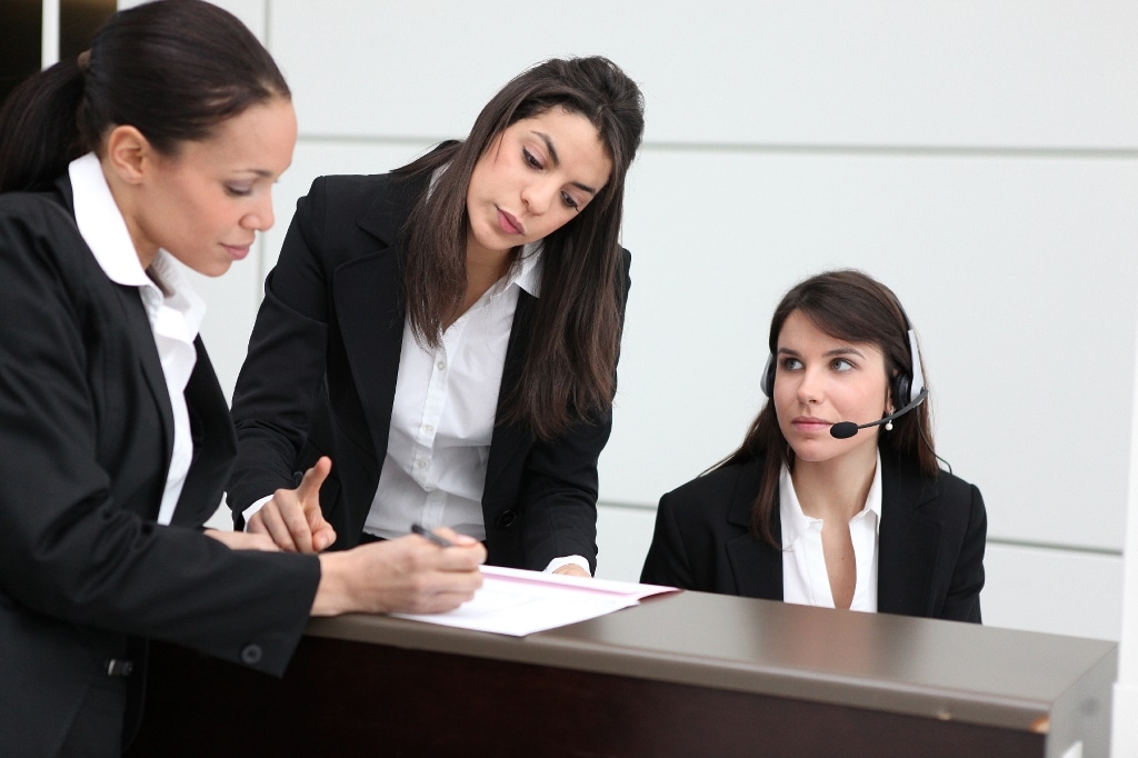 three business women reviewing documents