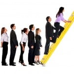 business group climbing ladder