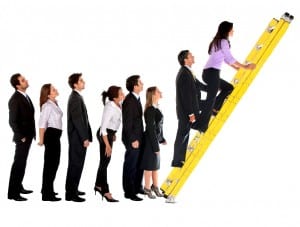 business group climbing ladder