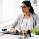businesswoman desk computer typing