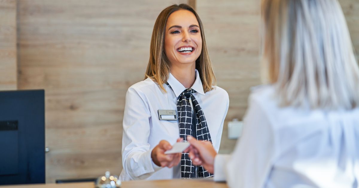 Woman in a people-focused career using communication and leadership skills that AI can’t easily replace.