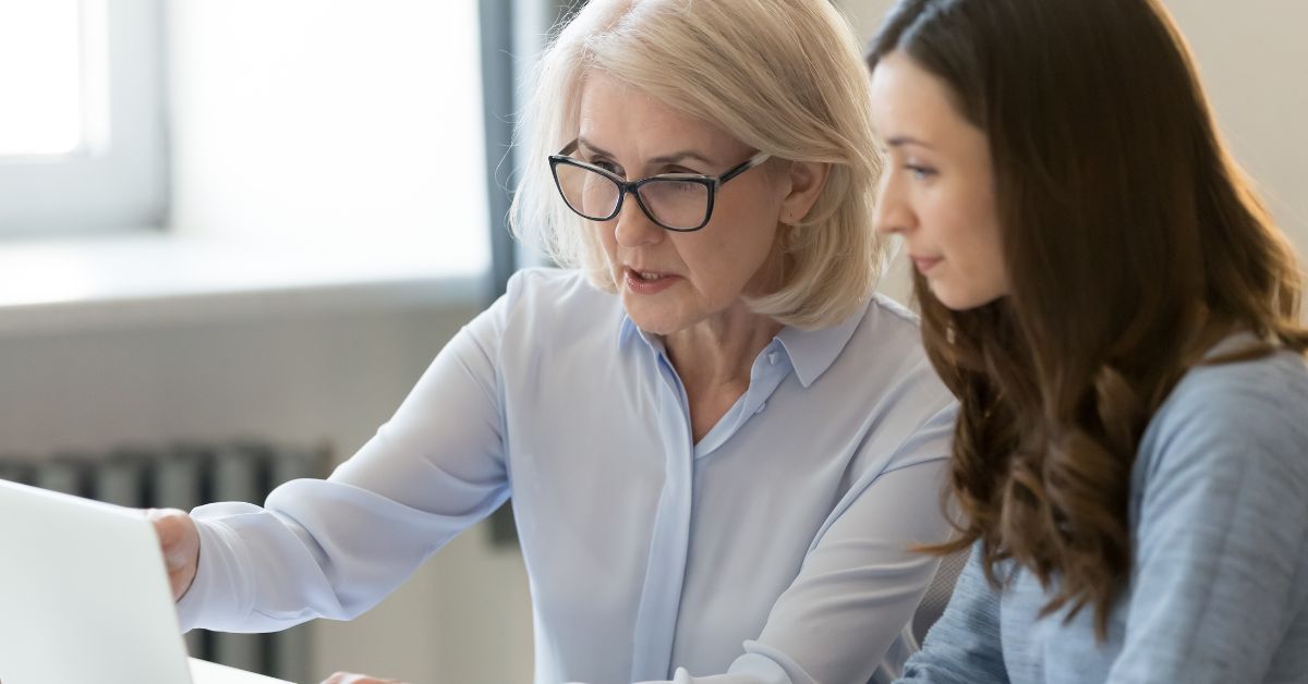 Woman reviewing AI-resistant career options that don’t require a college degree.