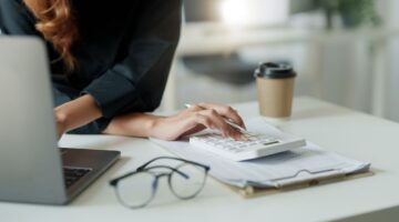 woman laptop calculator