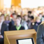 businesswoman speaking to audience
