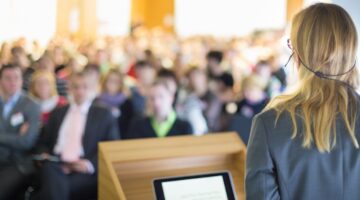 businesswoman speaking to audience