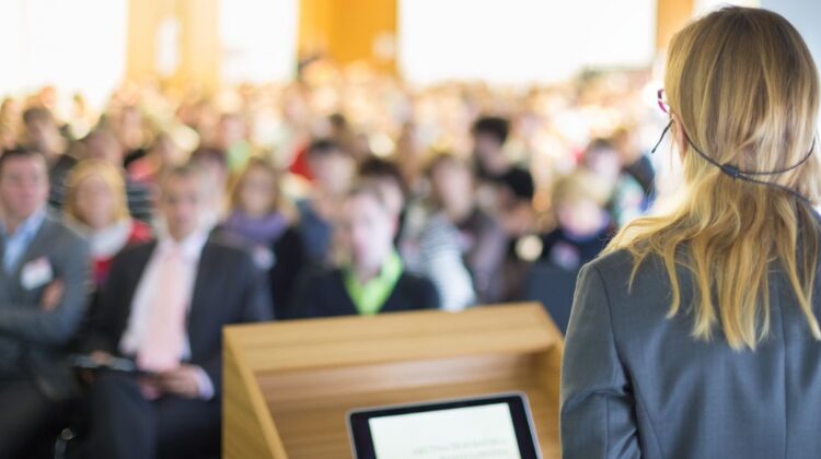 businesswoman speaking to audience