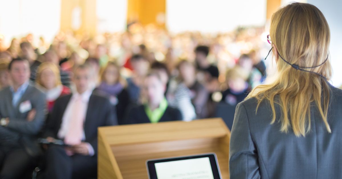 businesswoman speaking to audience