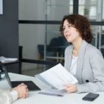 Woman business owner interviewing a leadership candidate using structured interview questions