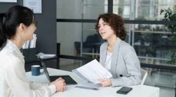 Woman business owner interviewing a leadership candidate using structured interview questions