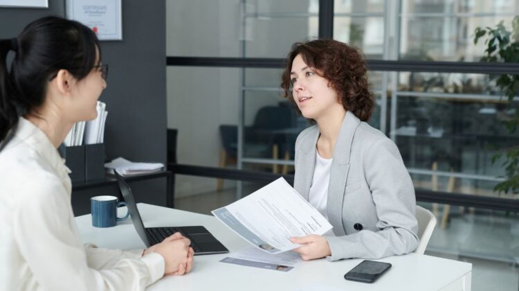 Woman business owner interviewing a leadership candidate using structured interview questions