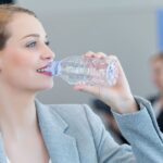 businesswoman drinking water