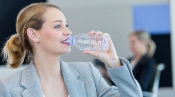 businesswoman drinking water