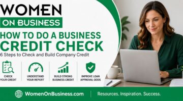 Woman at desk doing a business credit check online