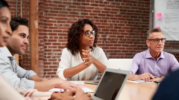 Professional women demonstrating leadership and management skills during a team discussion