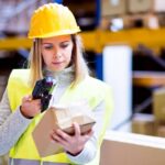 woman scanning item in warehouse