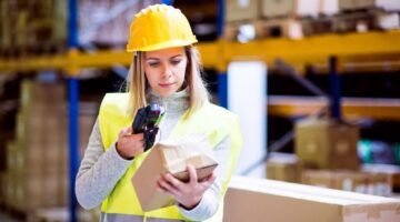 woman scanning item in warehouse