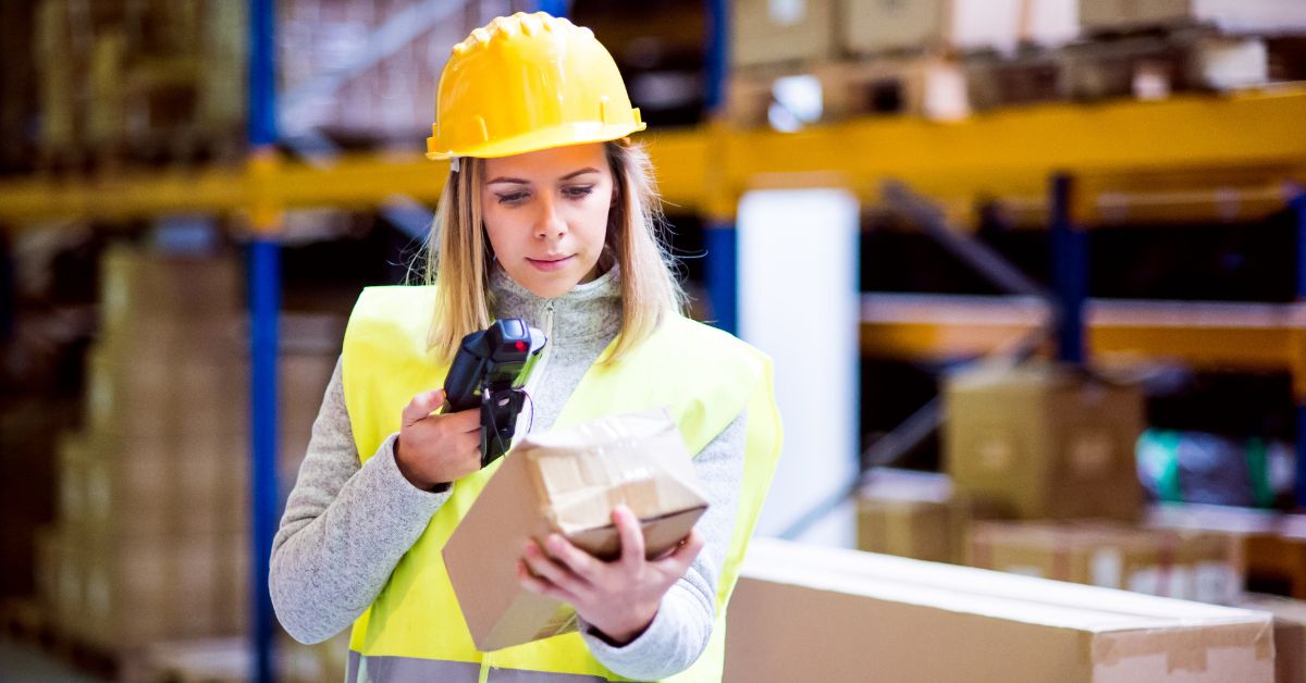 woman scanning item in warehouse