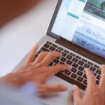 writing website content on laptop keyboard