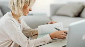 woman online school book and laptop