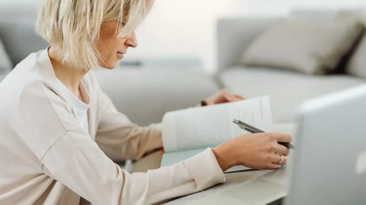 woman online school book and laptop