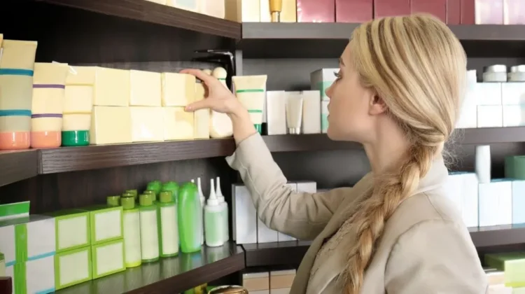woman shopping looking at blank packaging on store shelves